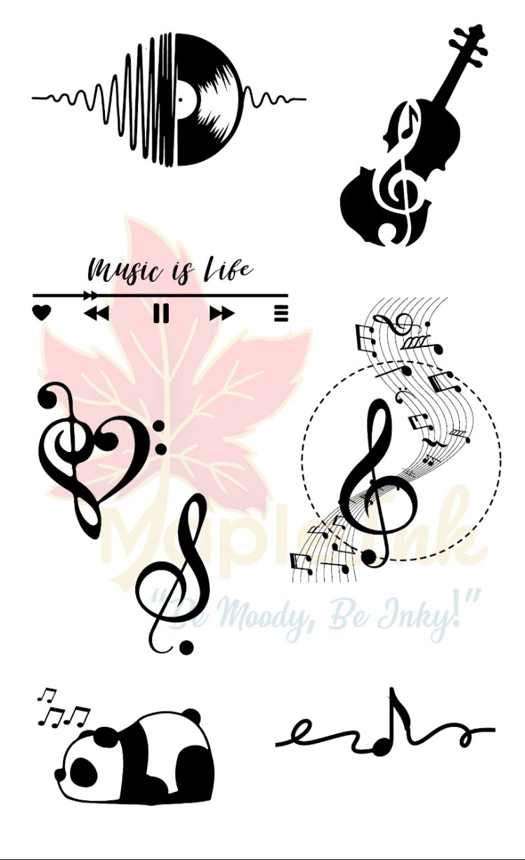 Collection of music-themed temporary tattoos with designs like a vinyl record, violin, and musical notes 